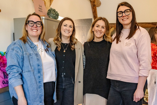 Leah, Harriet, Gina and Adele smiling at the camera at an event for Buns of Joy